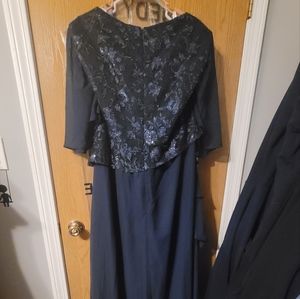 This dark navy dress, size 24w, has never been altered. Make an offer